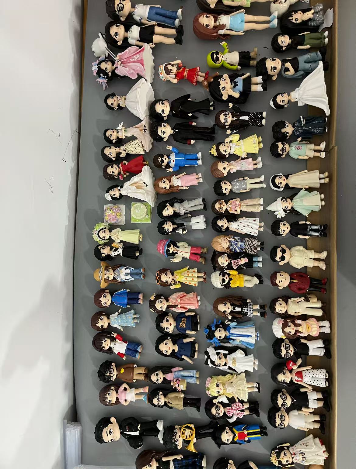 A collection of completed custom PixoFig figurines