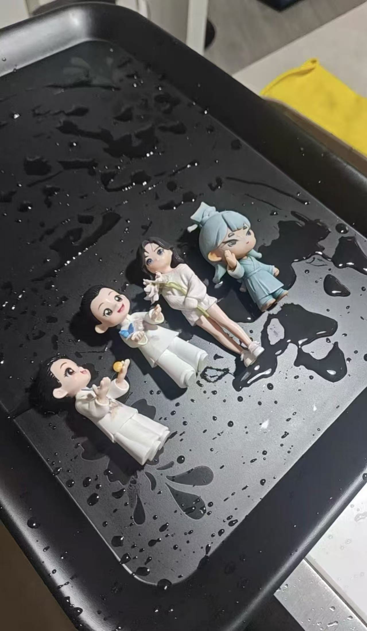 Custom figurines being cleaned during the finishing process