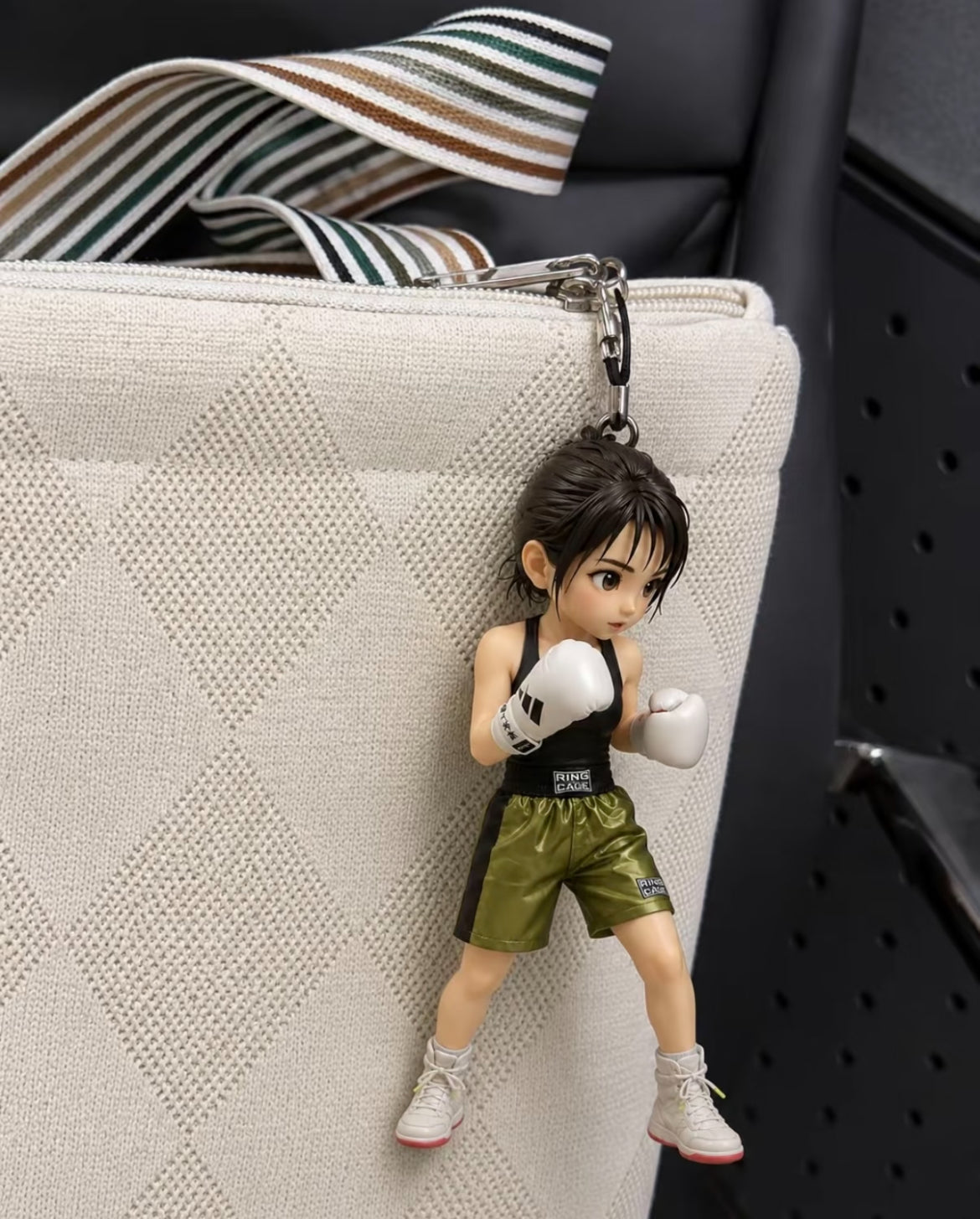 Custom boxing figurine keychain attached to a bag